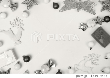 Demonstrating the colors of 2026 - Cloud Dancer. Christmas background made of decorative tree balls, stars, dragonflies, and candies with space for greetings, discounts, and text. Flat lay, copy space Demonstrating the colors of 2026 - Cloud Dancer. Christmas background made of decorative tree balls, stars, dragonflies, and candies with space for greetings, discounts, and text. Flat lay, copy space 133919453