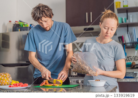 Woman and man preparing breakfast together in a bright kitchen, enjoying a warm morning routine. Home lifestyle, teamwork and cozy everyday living concept, reflecting connection, cooperation and a Woman and man preparing breakfast together in a bright kitchen, enjoying a warm morning routine. Home lifestyle, teamwork and cozy everyday living concept, reflecting connection, cooperation and a 133919619