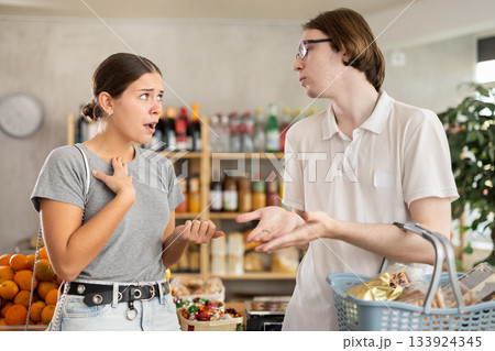 Couple quarrel in a supermarket 133924345