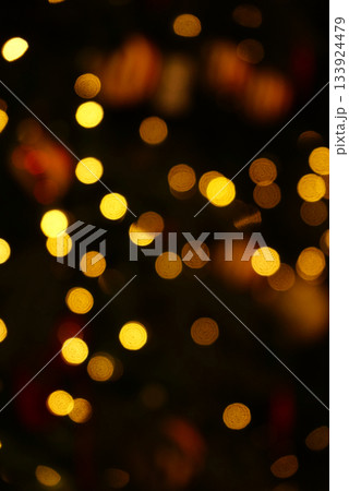 Organic real photo taken bokeh Xmas holiday tree lights garland night vertical abstract background Organic real photo taken bokeh Xmas holiday tree lights garland night vertical abstract background 133924479