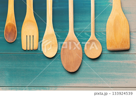 Wooden Utensils on Wooden Surface Background. File with Clipping Path. 133924539