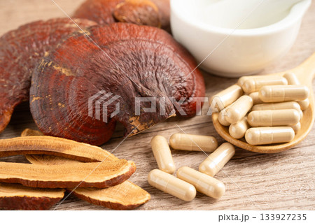Lingzhi or Reishi mushroom with capsules, organic natural healthy food. 133927235