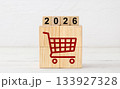Red Shopping Cart Icon on Wooden Blocks with 2026 Year Display 133927328