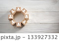 Wooden Blocks with Human Icons Arranged in Circular Shape on White Rustic Wooden Tabletop 133927332
