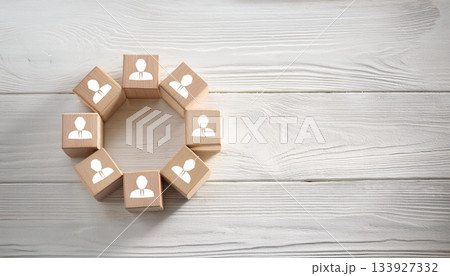 Wooden Blocks with Human Icons Arranged in Circular Shape on White Rustic Wooden Tabletop Wooden Blocks with Human Icons Arranged in Circular Shape on White Rustic Wooden Tabletop 133927332