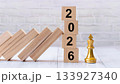 2026 Wooden Blocks Next to Gold King Chess Piece Symbolizing Leadership and Strategic Planning 133927340