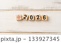 AI Technology Icon and Wooden Blocks Forming 2026 on Light Wooden Background Representing Artificial Intelligence Future 133927345