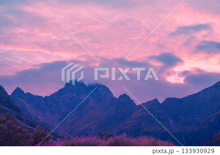 Beautiful mountains against the sunset sky. Silhouette of mountain peaks during sunset Beautiful mountains against the sunset sky. Silhouette of mountain peaks during sunset 133930929