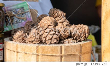 Pine cones in a wooden barrel Pine cones in a wooden barrel 133931738