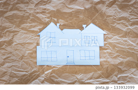 Paper house sketch on crumpled kraft paper background, creative architectural concept 133932099