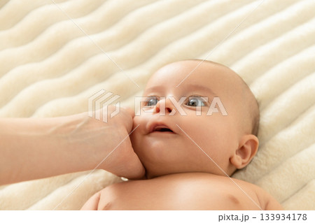 Joyful interaction between a mother and her newborn baby Joyful interaction between a mother and her newborn baby 133934178