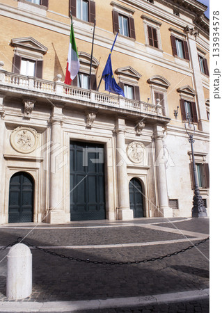 montecitorio palace entrance with italian and european flags in rome 133934578
