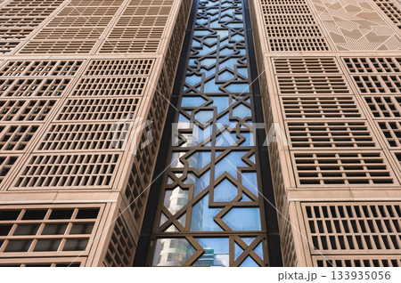 Contemporary skyscraper exterior unique design and reflective glass panels, abstract architecture 133935056