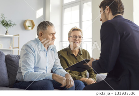 Senior couple having consultation with financial advisor about health insurance. 133935330