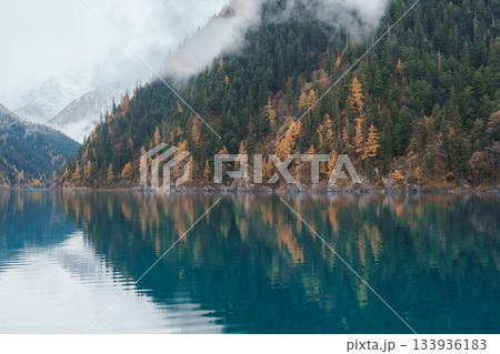 Scenery Jiuzhaigou national park in Sichuan, China. Beautiful Long lake and snow mountain in Autumn season. Famous Landmark and Vacation near Chengdu, China. Asia travel concept Scenery Jiuzhaigou national park in Sichuan, China. Beautiful Long lake and snow mountain in Autumn season. Famous Landmark and Vacation near Chengdu, China. Asia travel concept 133936183