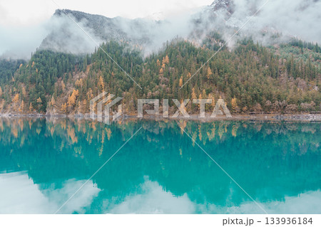 Scenery Jiuzhaigou national park in Sichuan, China. Beautiful Long lake and snow mountain in Autumn season. Famous Landmark and Vacation near Chengdu, China. Asia travel concept 133936184