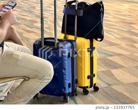 Colorful bright suitcases of tourists at the international airport. 133937765
