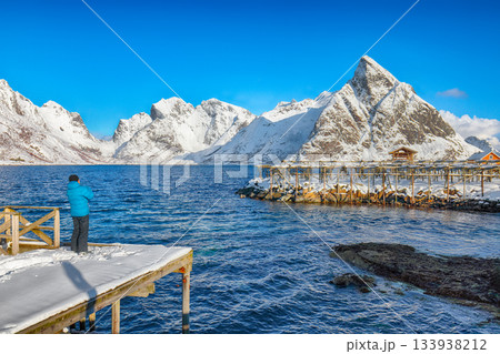 Photographer taking picture of Fantastic panorama of Reinefjorden on Toppoya island with Olstinden peak Photographer taking picture of Fantastic panorama of Reinefjorden on Toppoya island with Olstinden peak 133938212