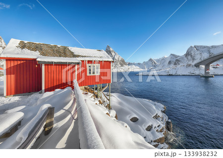 Winter view on Hamnoy village and bridge to Olenilsoya island. Winter view on Hamnoy village and bridge to Olenilsoya island. 133938232