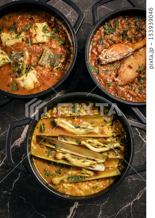 Portuguese traditional food fish soup and seafood risotto meal on restaurant table in lisbon Portuguese traditional food fish soup and seafood risotto meal on restaurant table in lisbon 133939046
