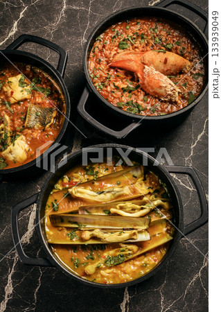 Portuguese traditional food fish soup  and seafood risotto meal on restaurant table in lisbon 133939049