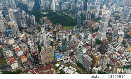 Kuala Lumpur, Malaysia - September 11, 2022: Aerial drone of capital of Malaysia is the city of Kuala Lumpur with skyscrapers and high-rise buildings. Kuala Lumpur, Malaysia - September 11, 2022: Aerial drone of capital of Malaysia is the city of Kuala Lumpur with skyscrapers and high-rise buildings. 133939144