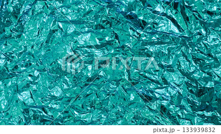 Abstract Texture of Crumpled Vibrant Teal Metallic Foil Background Abstract Texture of Crumpled Vibrant Teal Metallic Foil Background 133939832
