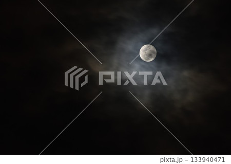 full moon covering by cloud floating on sky in night background full moon covering by cloud floating on sky in night background 133940471