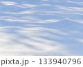 Fresh sparkling wavy snow snowdrifts close-up, perfect as a winter season background or texture 133940796