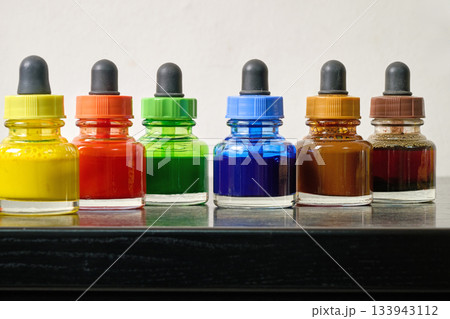 Indoor. Small bottles of colored watercolors 133943112