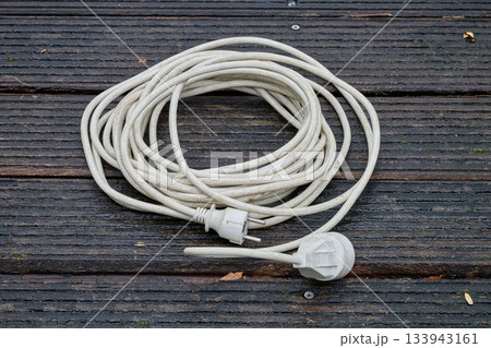 extension cord on wooden slats 133943161