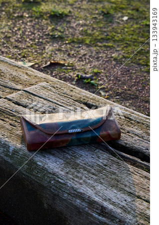 glasses and their case on wood 133943169