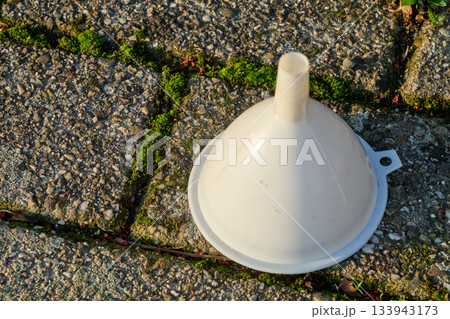 funnel  on the cobblestone floor 133943173