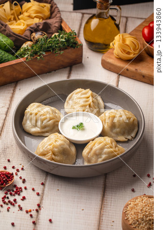 Steamed manty dumplings with savory filling Steamed manty dumplings with savory filling 133943860