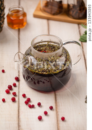 Herbal tea infusion with fresh berries Herbal tea infusion with fresh berries 133943893