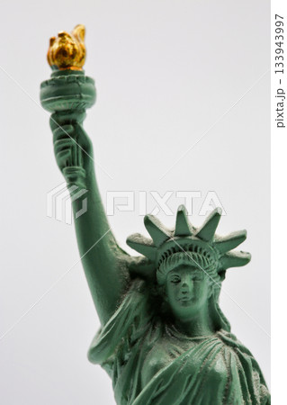 Statue of Liberty miniature figurine souvenir with green patina closeup. Statue of Liberty miniature figurine souvenir with green patina closeup. 133943997
