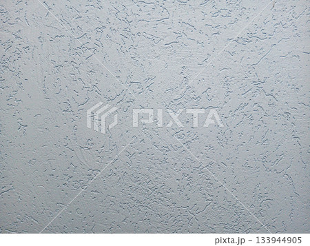 Neutral textured wall surface with a rough plaster finish for background use Neutral textured wall surface with a rough plaster finish for background use 133944905