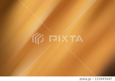 Abstract orange glow with diagonal streaks of warm light for a soft, modern background Abstract orange glow with diagonal streaks of warm light for a soft, modern background 133945697