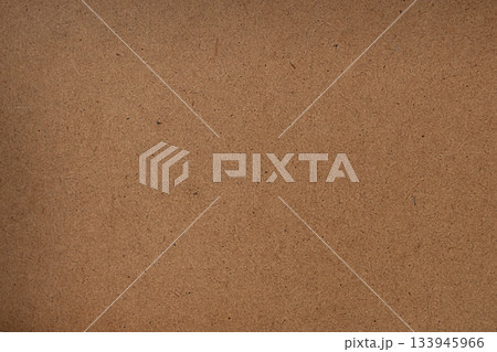 A close up of a warm brown cork board texture for background and design use 133945966