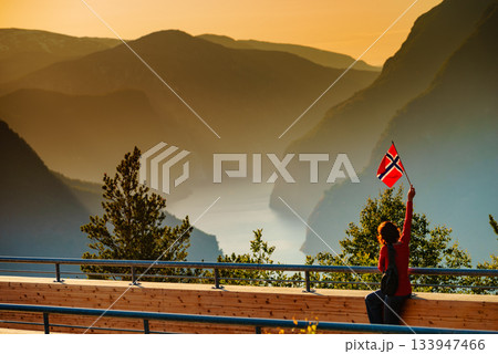 Tourist enjoy fjord view on Stegastein viewpoint Norway Tourist enjoy fjord view on Stegastein viewpoint Norway 133947466