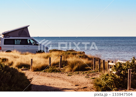Camper van with roof top tent camp on beach Camper van with roof top tent camp on beach 133947504