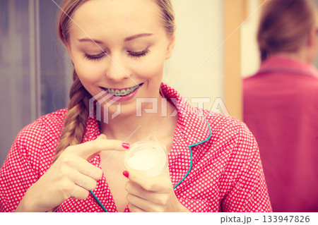 Woman applying moisturizing skin cream. Skincare. 133947826