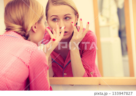 Woman applying moisturizing skin cream. Skincare. 133947827