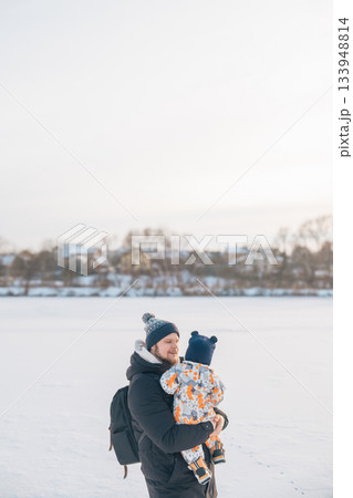 Father and child enjoying winter outdoors Father and child enjoying winter outdoors 133948814