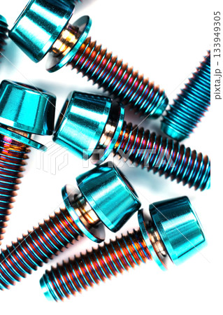 Blue titanium hexagonal bolts on a white background Blue titanium hexagonal bolts on a white background 133949305