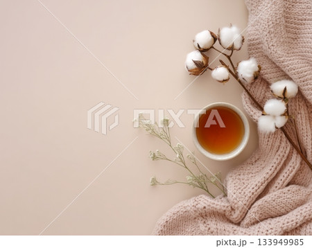 Cozy cup of tea with knitted blanket and cotton Cozy cup of tea with knitted blanket and cotton 133949985