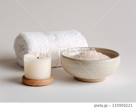 Minimal white spa setup with towel and sea salt 133950221