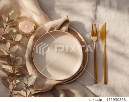 Elegant table setting with gold cutlery on beige Elegant table setting with gold cutlery on beige 133950268