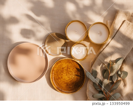 Burning candles on ceramic plates and fabric Burning candles on ceramic plates and fabric 133950499