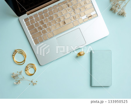 Laptop with coffee and accessories on mint desk 133950525